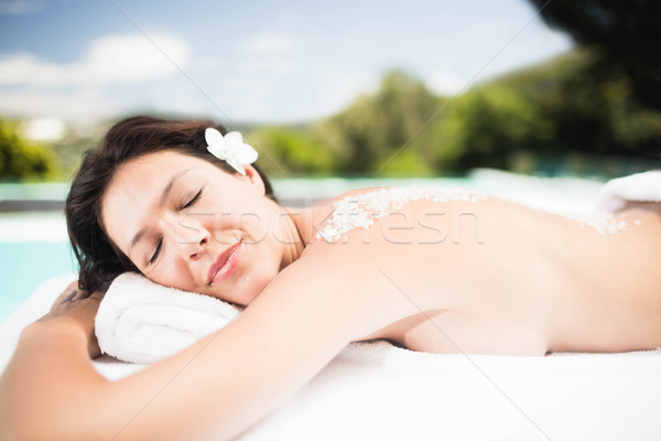 Woman lying on massage table with salt scrub on back  Stock photo © wavebreak_media