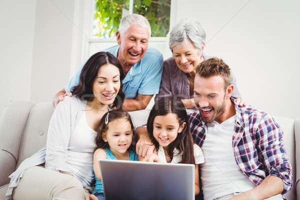 Smiling multi generation family using laptop  Stock photo © wavebreak_media