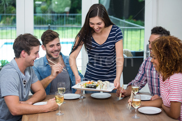 Kobieta sushi znajomych pitnej wina Zdjęcia stock © wavebreak_media