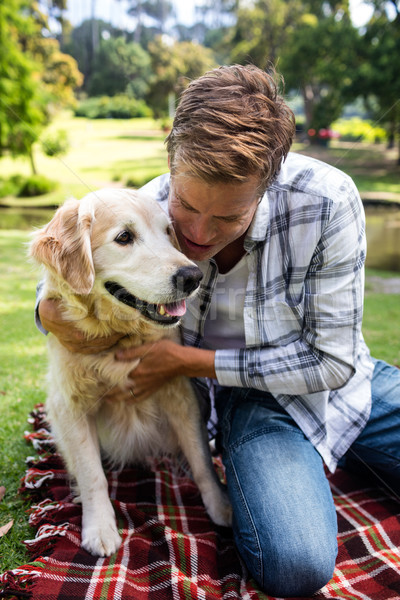 Man with his pet dog in the park Stock photo © wavebreak_media