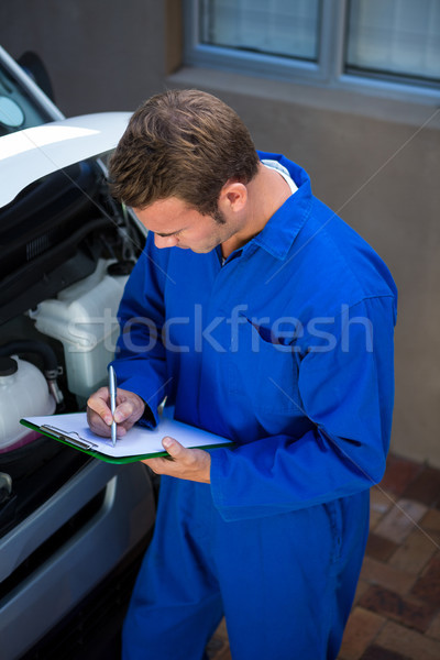 Mechanic preparing a check list Stock photo © wavebreak_media