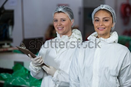 Female butchers maintaining records over digital tablet Stock photo © wavebreak_media