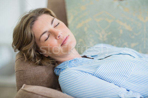 Woman sleeping on couch in living room at home Stock photo © wavebreak_media