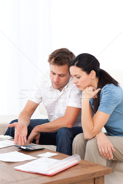 Desesperado casal conta sessão sofá sala de estar Foto stock © wavebreak_media