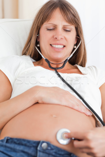 Foto d'archivio: View · donna · incinta · stetoscopio · divano