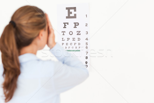 Beautiful brunette woman making an eye test in a surgery Stock photo © wavebreak_media
