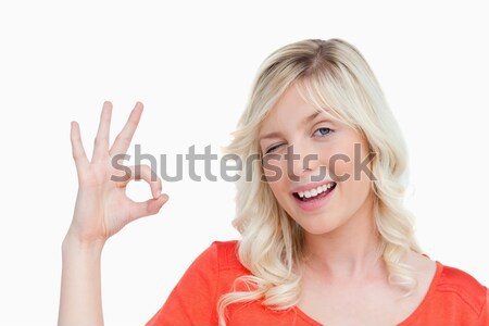 Jeune femme signe oeil blanche [[stock_photo]] © wavebreak_media
