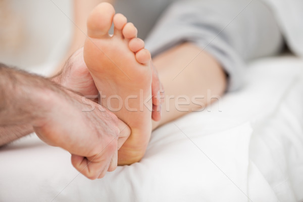 Ball of a foot being touched by a doctor in a room Stock photo © wavebreak_media
