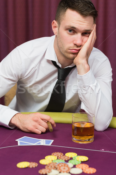 Férfi néz lehangolt póker asztal kaszinó Stock fotó © wavebreak_media