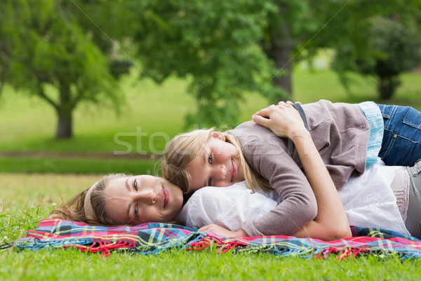 Relaxed mother and daughter lying at park Stock photo © wavebreak_media