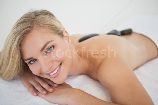 Beautiful blonde enjoying a hot stone massage  Stock photo © wavebreak_media