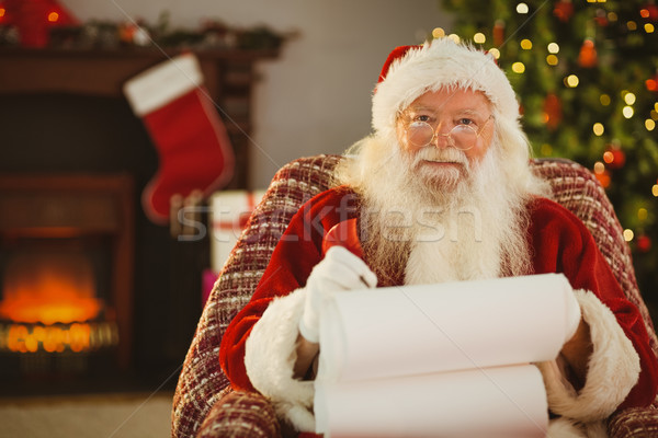 Happy santa writing list with a quill Stock photo © wavebreak_media