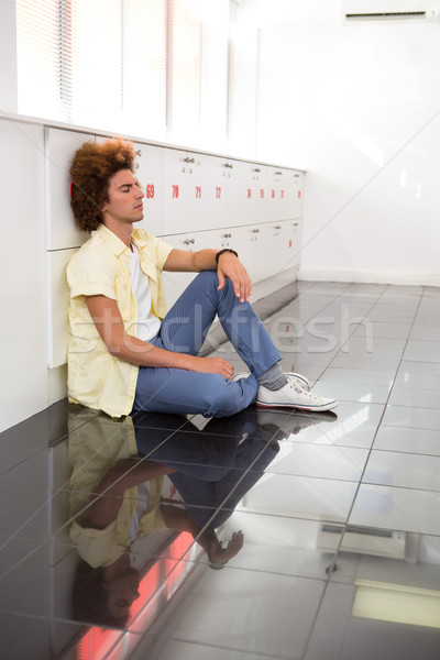 Tensed young man in office corridor Stock photo © wavebreak_media