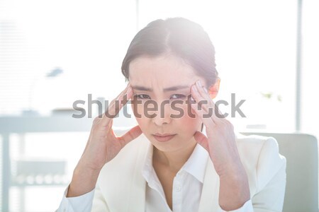Doctor suffering from a migraine Stock photo © wavebreak_media