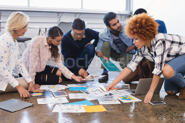 Creative business colleagues discussing over documents Stock photo © wavebreak_media
