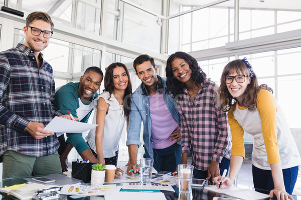 Portrait of young business team discussing at creative office Stock photo © wavebreak_media