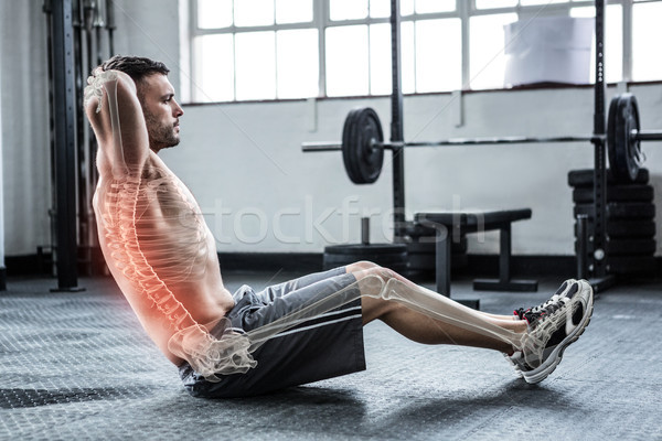 Highlighted spine of exercising man at gym Stock photo © wavebreak_media