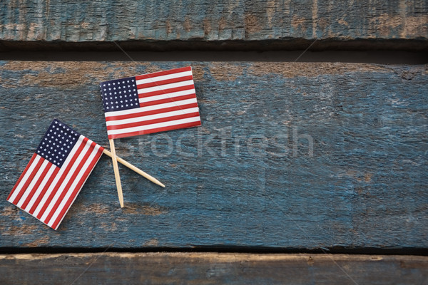 Two American flags on a wooden table Stock photo © wavebreak_media