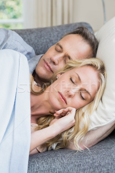 Cute couple napping on the couch Stock photo © wavebreak_media