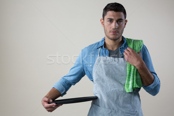 Stock photo: Waiter standing with a tray and napkin