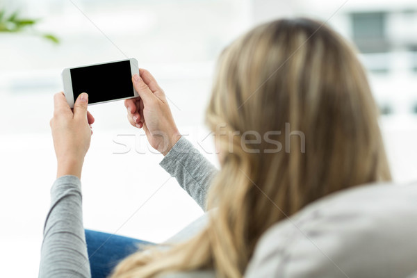 Pregnant woman using smartphone Stock photo © wavebreak_media