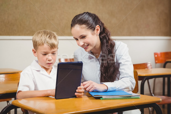 Stock photo: Teacher helping a student in class