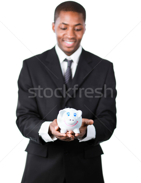 Portrait of an handsome businessman holding a piggy bank  Stock photo © wavebreak_media