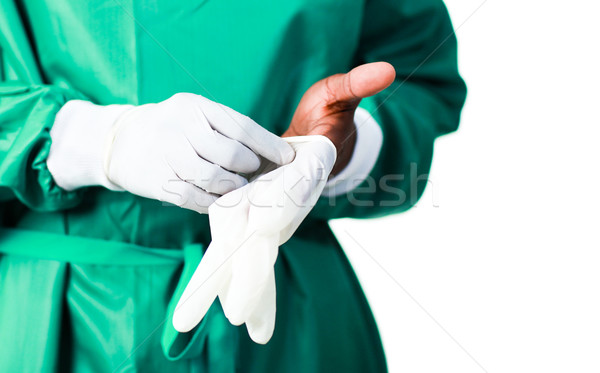 Surgeon putting on his gloves Stock photo © wavebreak_media
