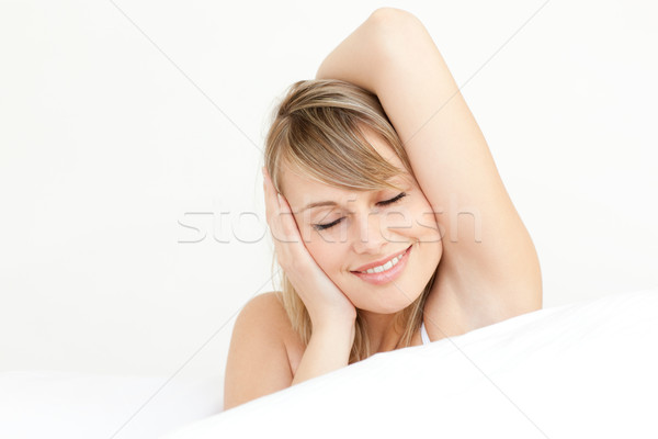 Portrait of a charming woman waking up  Stock photo © wavebreak_media