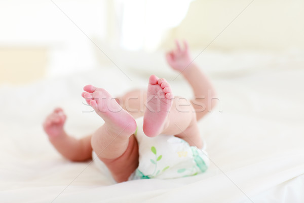 Stock photo: Baby relaxing in bed
