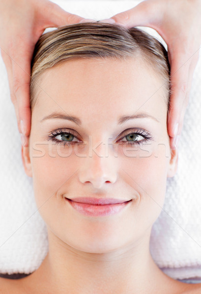 Young smiling woman receiving a head massage in a spa centre Stock photo © wavebreak_media