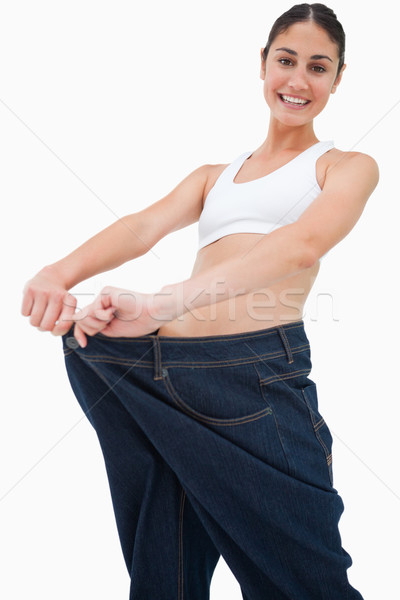 Brunette jeans grand blanche permanent régime alimentaire [[stock_photo]] © wavebreak_media