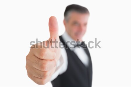 Well-dressed waiter having thumbs up Stock photo © wavebreak_media