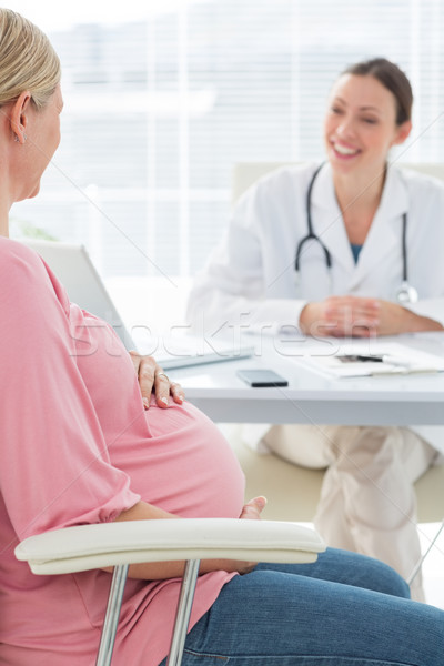 Pregnant woman consulting female doctor Stock photo © wavebreak_media