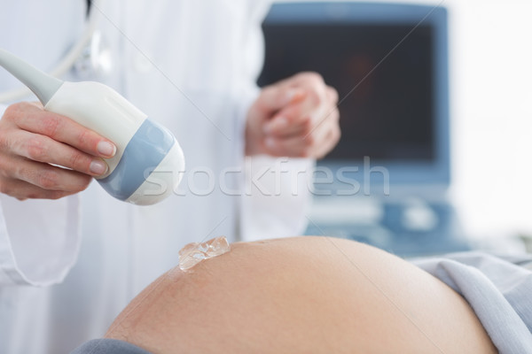 Stok fotoğraf: Doktor · jel · göbek · hamile · kadın · ultrason