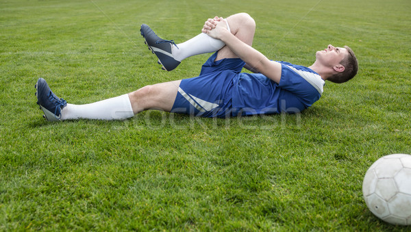Voetballer Blauw gewond toonhoogte gras voetbal Stockfoto © wavebreak_media