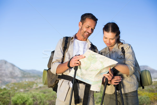 Hiking couple consulting the map in the countryside Stock photo © wavebreak_media