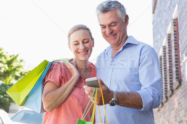ストックフォト: 幸せ · 見える · スマートフォン · ショッピングバッグ