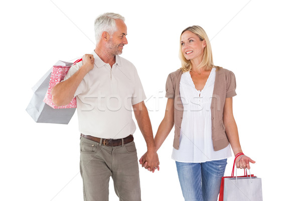 Boldog pár tart bevásárlótáskák kezek fehér Stock fotó © wavebreak_media