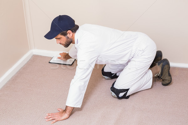 Handyman laying down a carpet Stock photo © wavebreak_media