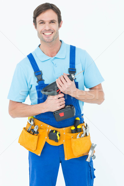 Confident carpenter holding drill machine Stock photo © wavebreak_media