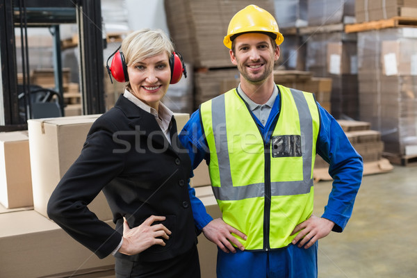 Warehouse worker and his manager with hands on hips Stock photo © wavebreak_media