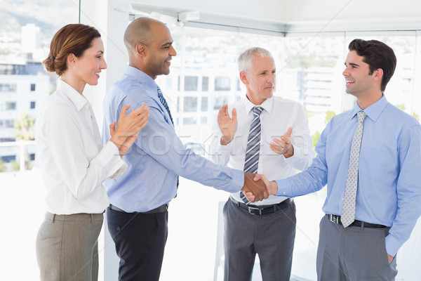 Business team congratulating their colleague Stock photo © wavebreak_media