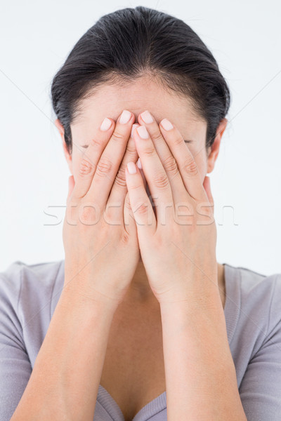 Sad woman hiding her face Stock photo © wavebreak_media