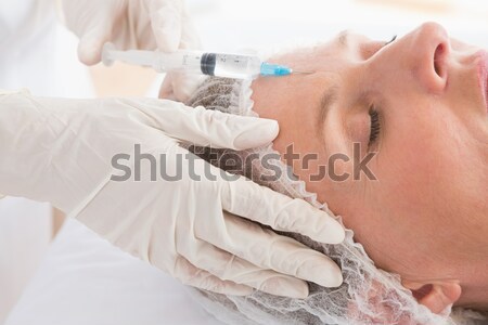 Donna botox iniezione fronte bella bruna femminile Foto d'archivio © wavebreak_media