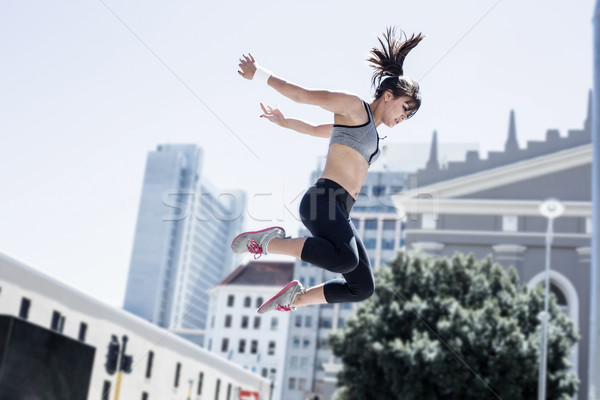 Woman doing parkour in the city Stock photo © wavebreak_media