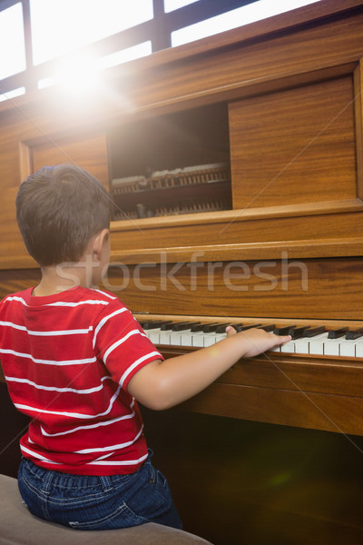 Rear view of boy playing piano in classroom Stock photo © wavebreak_media