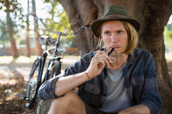 Homme fumer électronique cigarette parc [[stock_photo]] © wavebreak_media