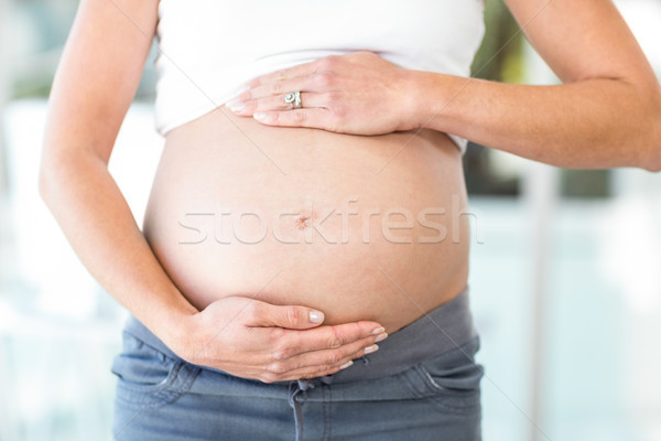 Midsection of woman with hands on belly Stock photo © wavebreak_media