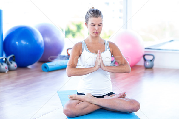 Woman meditating in fitness studio Stock photo © wavebreak_media